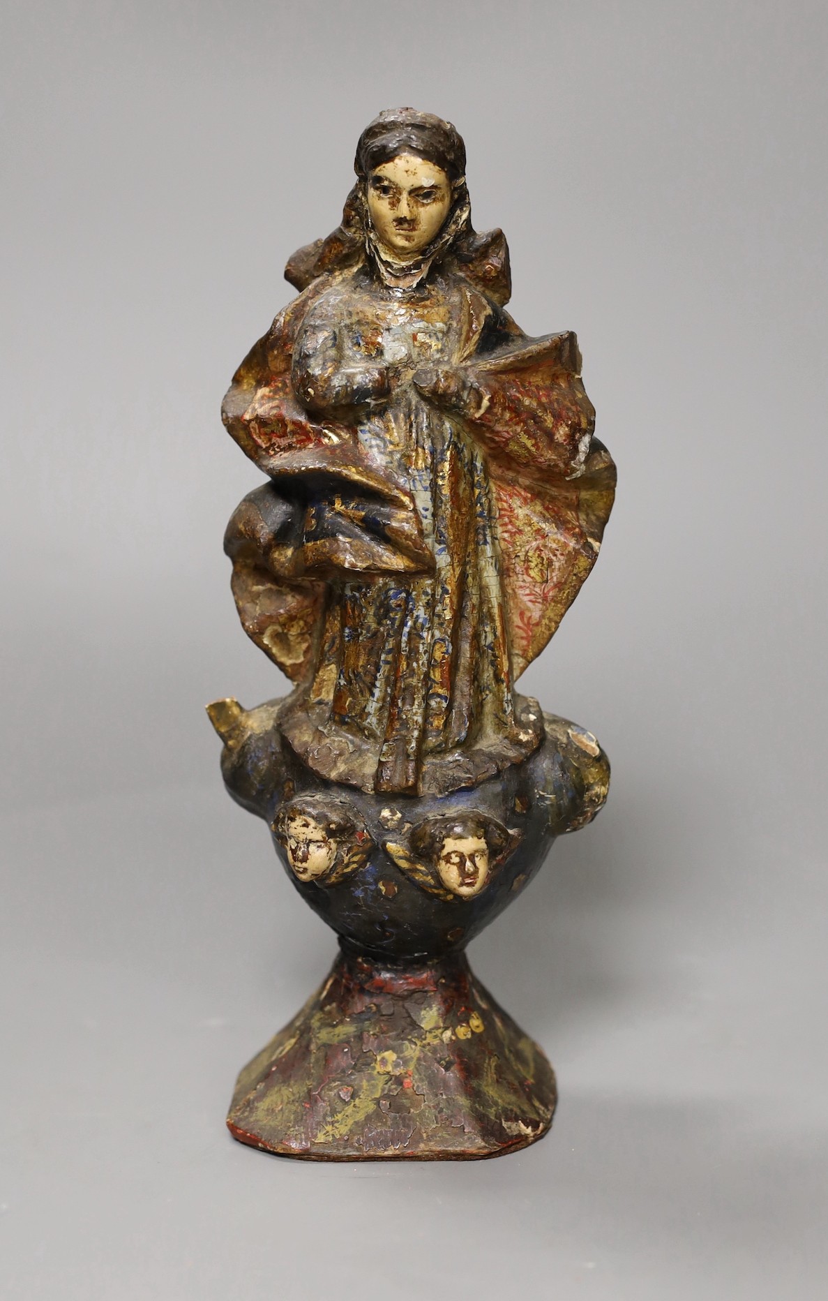 A 17th century Jesuit carved figure of a saint, 23cm